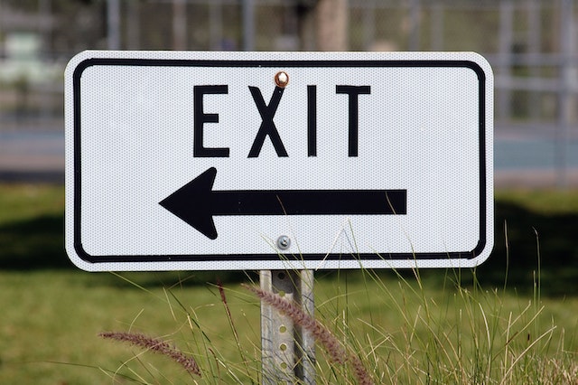 Exit Signage Pointing at Left Side